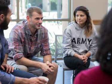 Veterans talk in a group therapy session, photo by SDI Productions/Getty Images