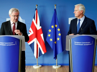 Britain's Secretary of State for Exiting the EU David Davis and EU's chief Brexit negotiator Michel Barnier talk to the media ahead of Brexit talks in Brussels, Belgium, September 25, 2017