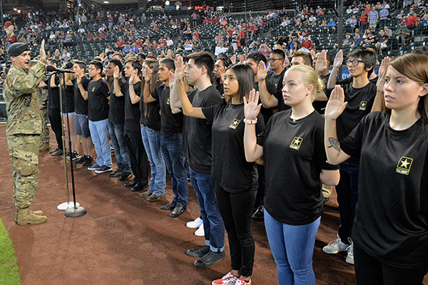 Lt. Col. Scott Morley, commander of the Phoenix Recruiting Battalion, administers the oath of enlistment to 40 future soldiers, August 26, 2018, at Chase Field, photo by Mike Scheck/U.S. Army