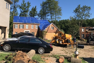 A house in Annapolis, Maryland, is covered with a blue tarp due to damage from a tornado that was produced by the remnants of Tropical Storm Ida on September 1, 2021.