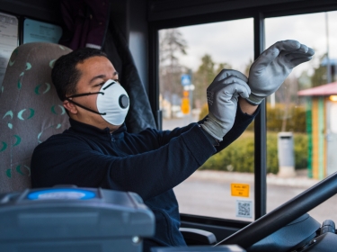 Bus driver wears a face mask to protect himself from the coronavirus epidemic, photo by Uliana Nadorozhna/Adobe Stock