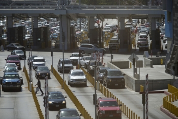 Cars line up as they wait to cross into the United States from Mexico at the San Ysidro border crossing in San Ysidro, California, August 18, 2015