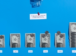 Photographic data visualization by Gabrielle M&eacute;rite representing the prices of brand-name drugs with real money on a blue background. For the same pill, the U.S cost is $10 while Germany and Canada’s cost would be $3.50, Japan's $3.25, the UK's $3.00 and Mexico's $2.75.