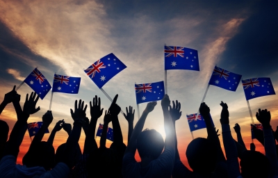 Group of people waving Australian flags 