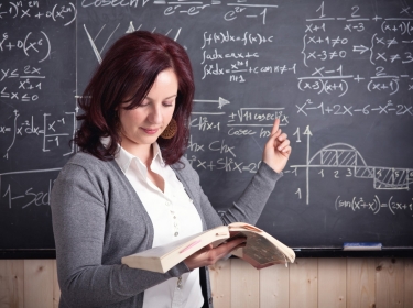 calculus teacher at the chalkboard