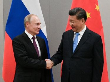 Russian President Vladimir Putin shakes hands with Chinese President Xi Jinping during their meeting on the sidelines of a BRICS summit, in Brasilia, Brazil, November 13, 2019, photo by Ramil Sitdikov/Sputnik via Reuters