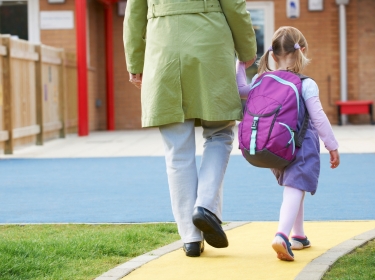 parent taking child to school