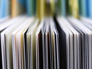 Closeup of the edges of open books, photo by FactoryTh/Getty Images