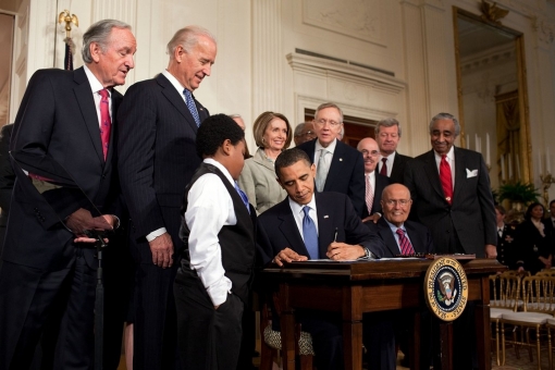 President Barack Obama signing the Patient Protection and Affordable Care Act at the White House, March 23, 2010