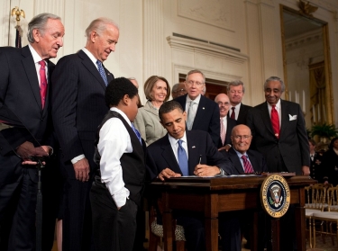 Barack Obama signing the Patient Protection and Affordable Care Act at the White House, March 23, 2010