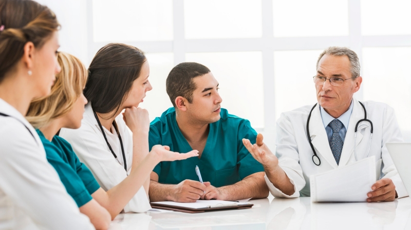 Group of doctors and nurses having a meeting