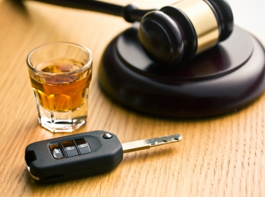 Gavel, alcoholic drink, and car keys