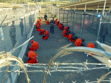 U.S. military police guard detaintees in Guantanamo Bay
