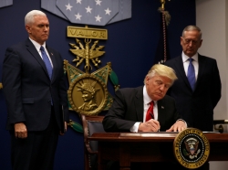 U.S. President Donald Trump signs an executive order intended to impose tighter vetting to prevent foreign terrorists from entering the United States, January 27, 2017