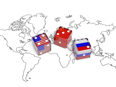 Dice representing flags of United States, China, and Russia on a world map