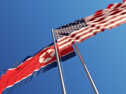 American and North Korean flags facing opposite directions