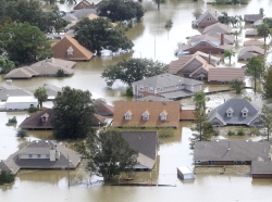 Houses are partially submerged in flood waters after a Hurricane Isaac levee breach in Braithwaite, Louisiana August 31, 2012