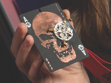 Close up of Lily Ablon holding DEFCON 21 challenge medal