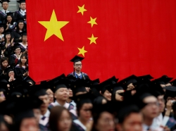 Students attend a graduation ceremony at Fudan University in Shanghai, China, June 23, 2017