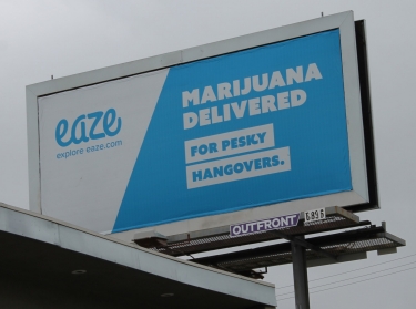 A billboard advertising marijuana delivery