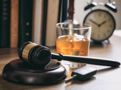 Law gavel, alcohol and car keys on a wooden desk, photo by Rawf8/Adobe Stock