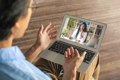 Man speaking to his psychologist via telemedicine