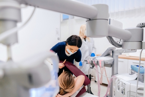 Radiology tech preparing a patient for a mammogram