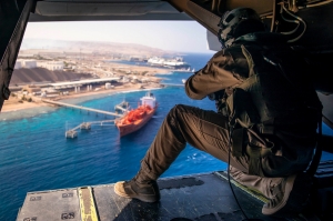 A U.S. Marine with Marine Medium Tiltrotor Squadron (VMM) 364, attached to Special Purpose Marine Air-Ground Task Force-Crisis Response-Central Command, participates in a simulated air-raid as part of the Middle East Amphibious Commanders Symposium, Sept. 24, 2019
