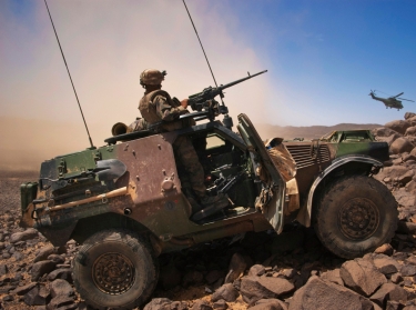 A French soldier stands guard in an armoured vehicle in the Terz valley, in northern Mali, March 21, 2013