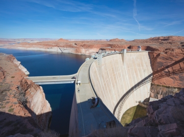 The Glen Canyon Dam in northern Arizona was built to provide hydroelectricity and flow regulation from the upper Colorado River Basin to the lower