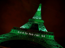 The Eiffel tower is illuminated in green with the words "Paris Agreement Is Done" to celebrate the Paris U.N. COP21 Climate Change agreement in Paris, France, November 4, 2016