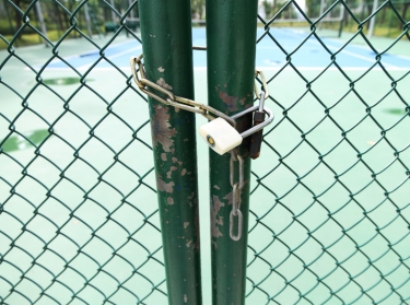 Locked entrance to a school playground