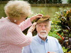 an elderly couple, man possibly with dementia