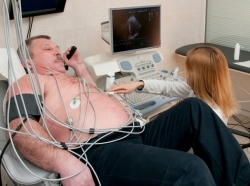 man getting his heart examined by a doctor