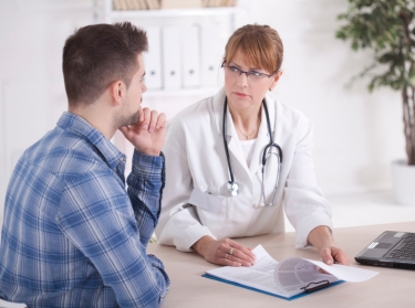 A man talking to a doctor