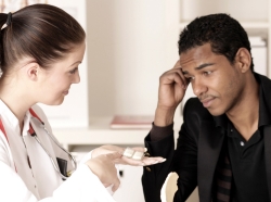 Young African American male with doctor