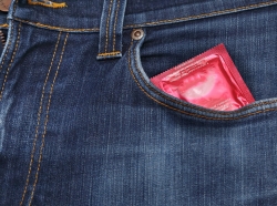 Condom in a blue jeans pocket