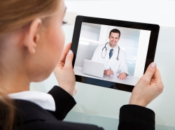 Woman having a video chat with doctor on a tablet