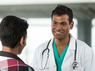 an Indian doctor talking to a patient