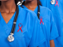 doctors wearing red ribbons for HIV/AIDS awareness