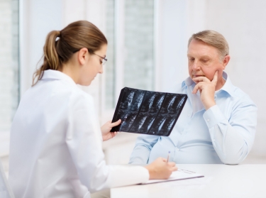 doctor with a senior patient reviewing an x-ray