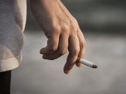 A smoker with a cigarette in hand