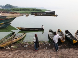 Ggaba, Uganda - June 30, 2011: Fishing boats line the banks of Lake Victoria after most fishermen have come in for the day.