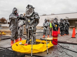 Emergency response personnel perform technical decontamination