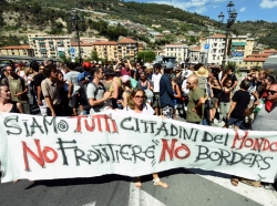 Protesters hold a banner reading 'We are all citizens of the world, no frontier, no borders' in Ventimiglia, Italy, August 7, 2016