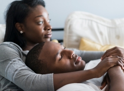 Young African American couple in bed