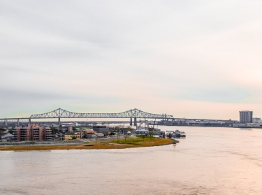 The Crescent City Connection (formerly Greater New Orleans Bridge) and Mississippi River in late afternoon