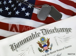 Military identification tags next to a certificate of Honourable Discharge on top of a United States flag