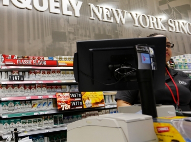 Cigarettes are displayed behind the counter of a convenience store in New York, March 18, 2013