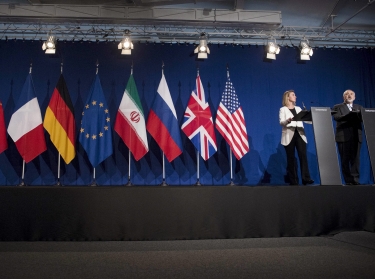 Iranian Foreign Minister Javad Zarif (R) makes a statement as European Union High Representative for Foreign Affairs and Security Policy Federica Mogherini watches, following nuclear talks at the Swiss Federal Institute of Technology in Lausanne, April 2, 2015. 